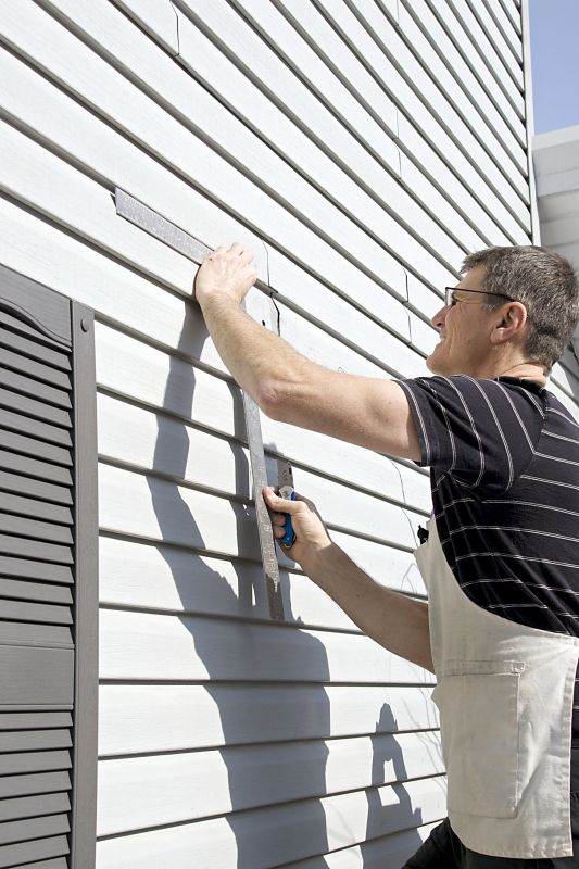 Installer Measuring Siding